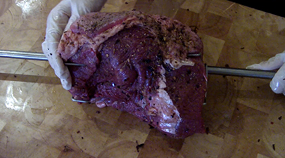 This image shows a meat inserted on the skewer