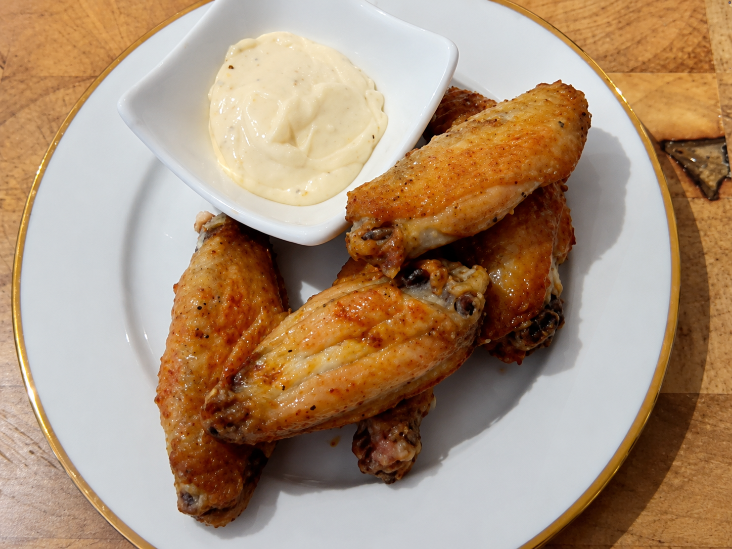 This image shows spit roasted chicken wings.