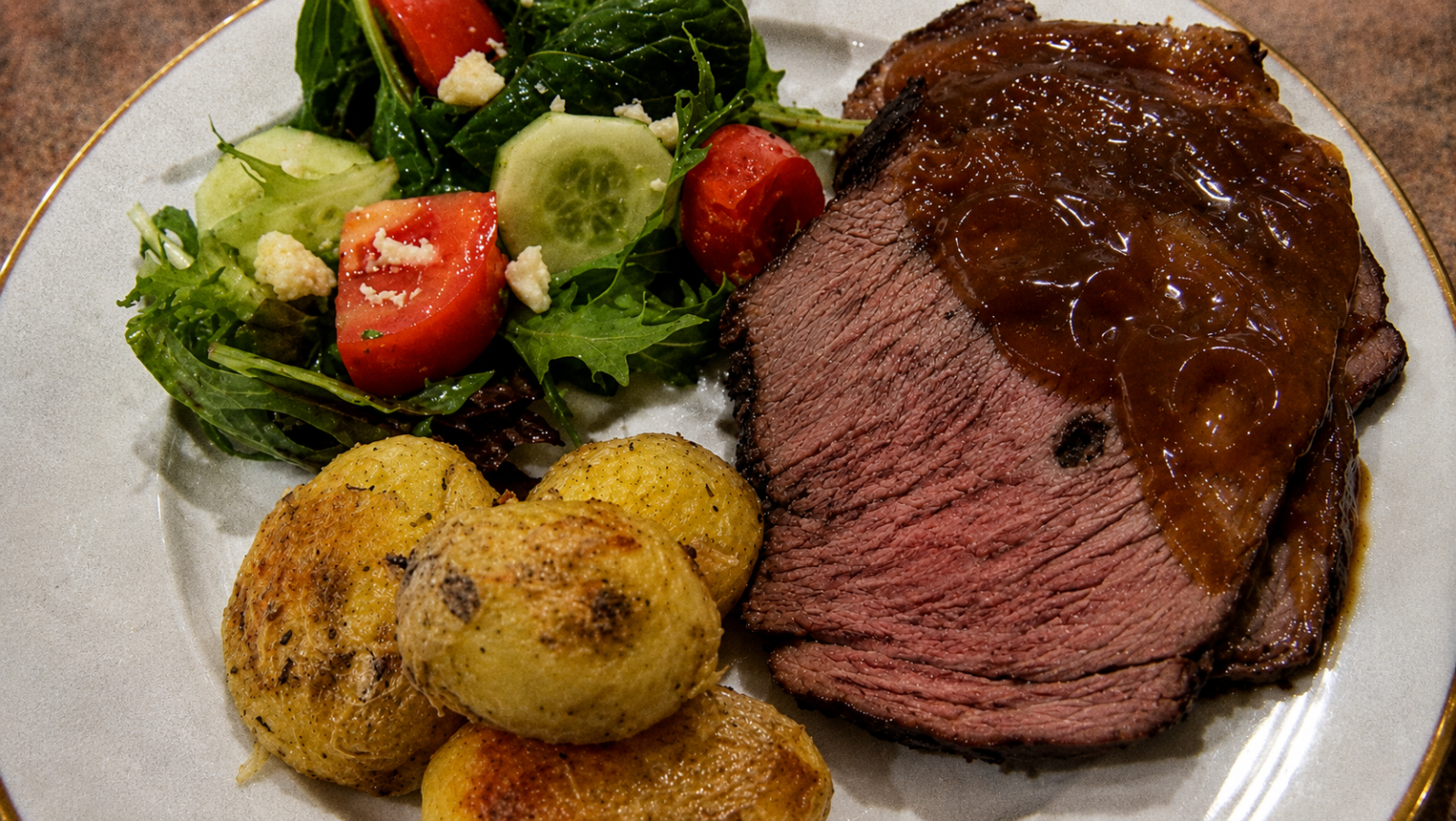 This image shows a photo of a beef roast with veggies