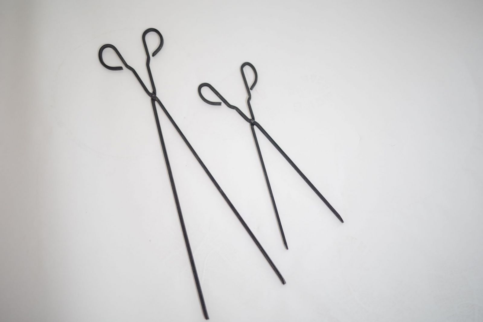 This image shows the 2 different sizes you can the Fireplace charcoal tongs
