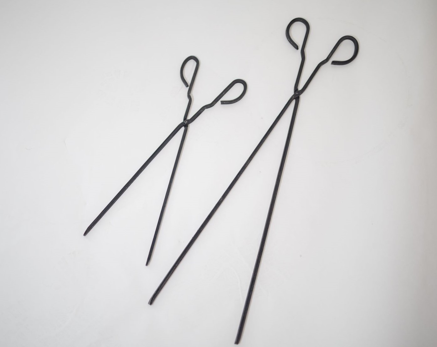 This is an image shows the 2 different length Fireplace tongs available to buy in Australia