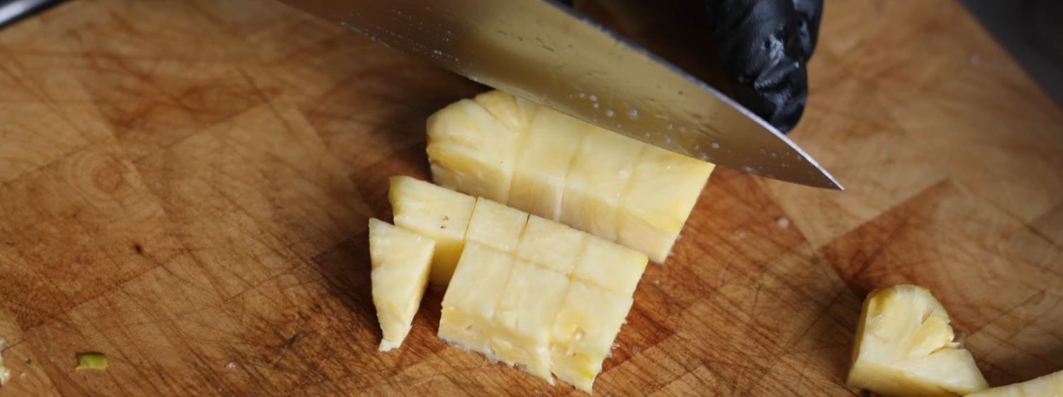 This image shows pineapple cut into pieces