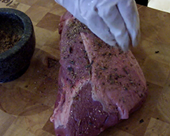 This image shows a meat with seasoning. 