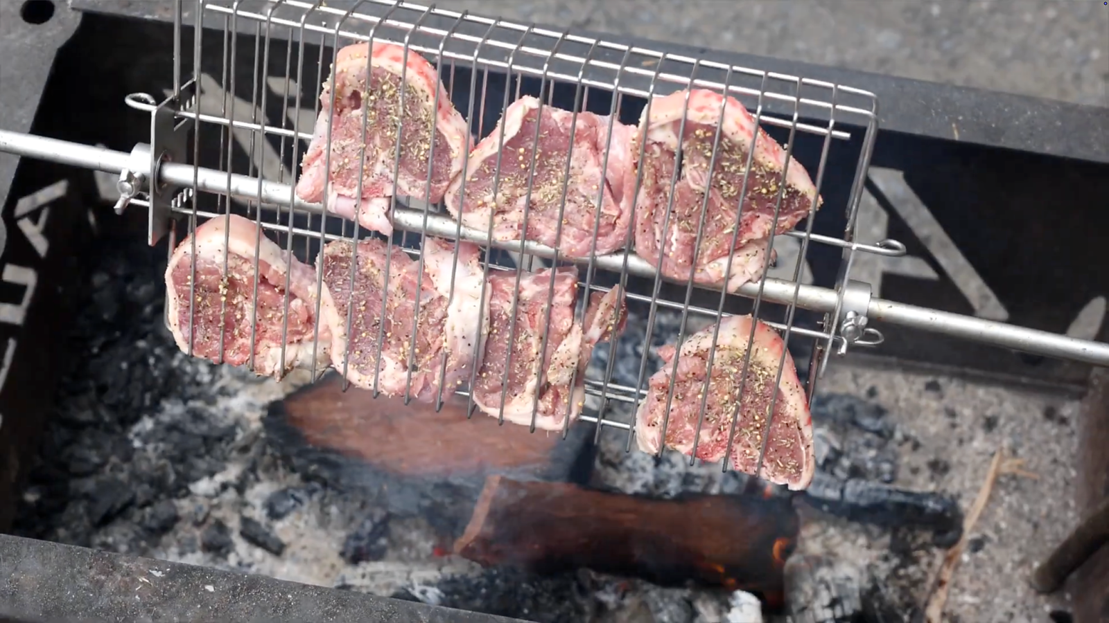 This image shows lamp chops in a rotisserie basket. This image shows lamp chops in a rotisserie basket.