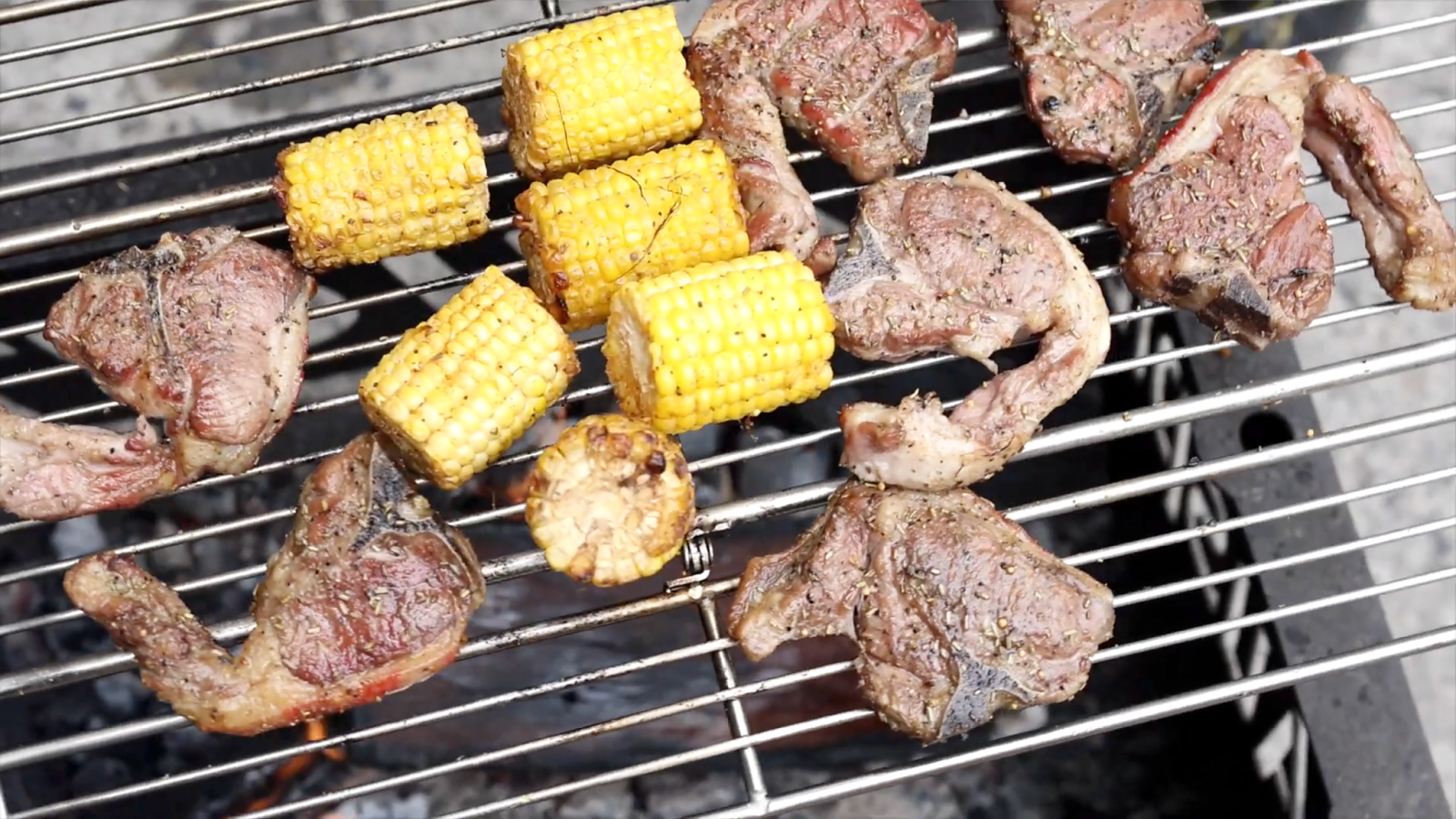 This image shows lamb chops and corn on the folding basket. This image shows lamb chops and corn on the folding basket.