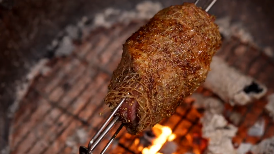 Lamb Shoulder Cooking On Spit Rotisserie Over Charcoal