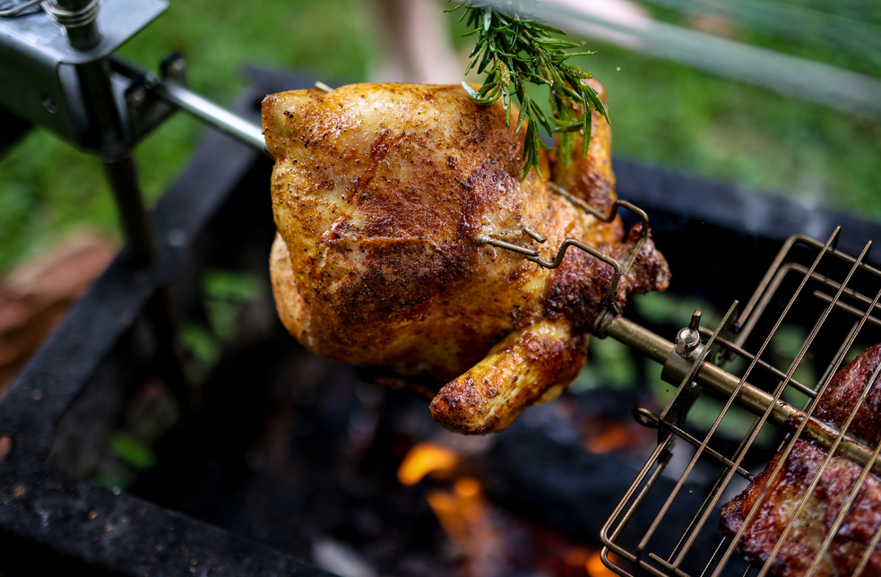This_image_shows_whole_chicken_being_cooked_on_Auspit_Rotisserie