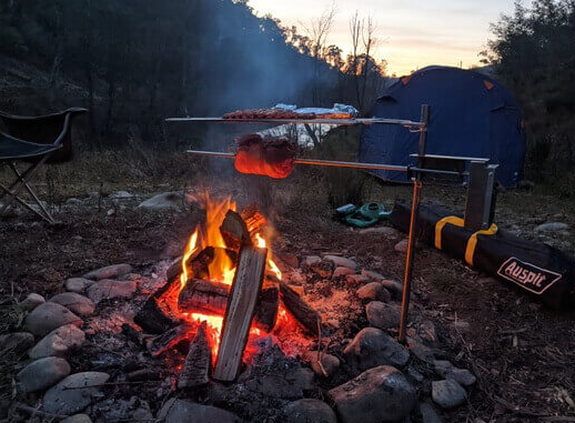 This_image_shows_Auspit_Rotisserie_being_used_for_cooking_meat_during_camping 